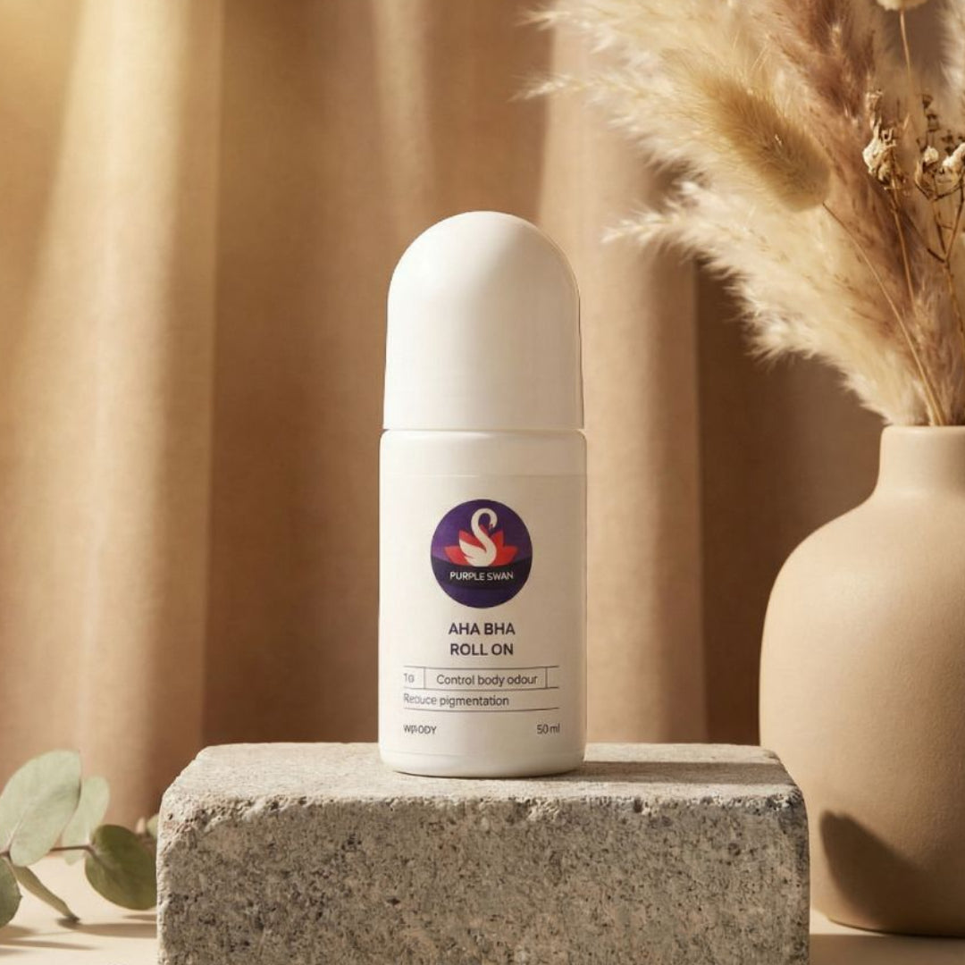 White roll-on bottle with a swan logo on a stone surface with a neutral background