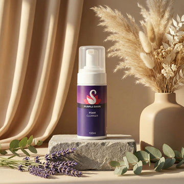 Foam cleanser bottle with decorative elements on a neutral background
