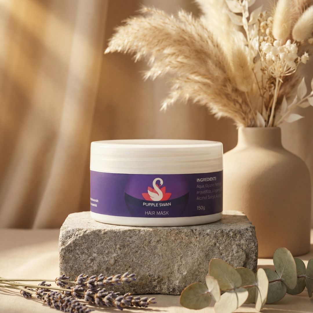 Purple Swan hair mask jar on a stone surface with decorative elements like lavender and a vase in the background.