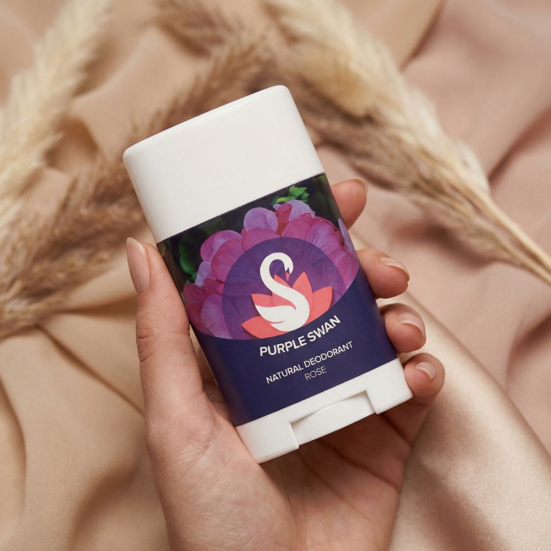Hand Holding Purple Swan Rose Natural Deodarant 