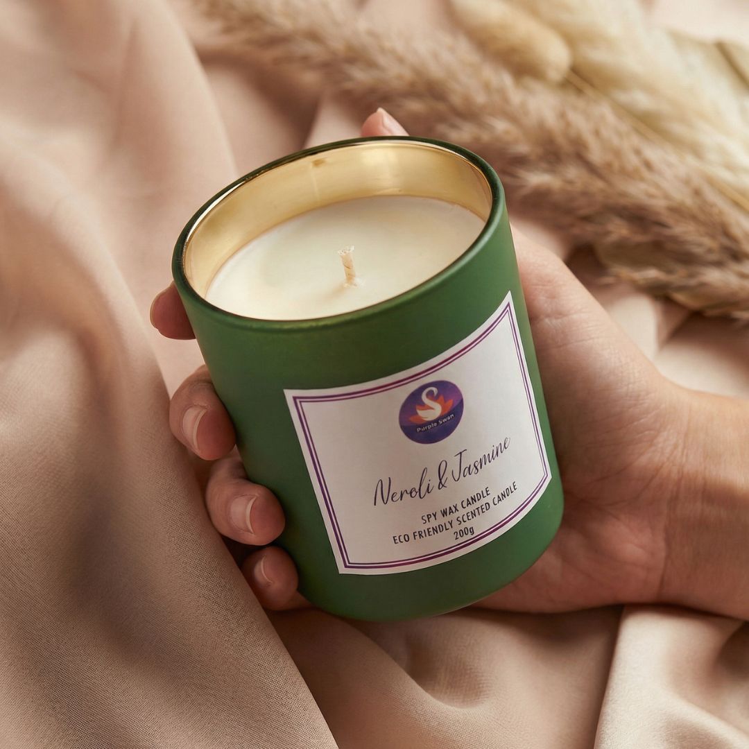 Hand Holding Purple Swan  Neroli Wax Candle 