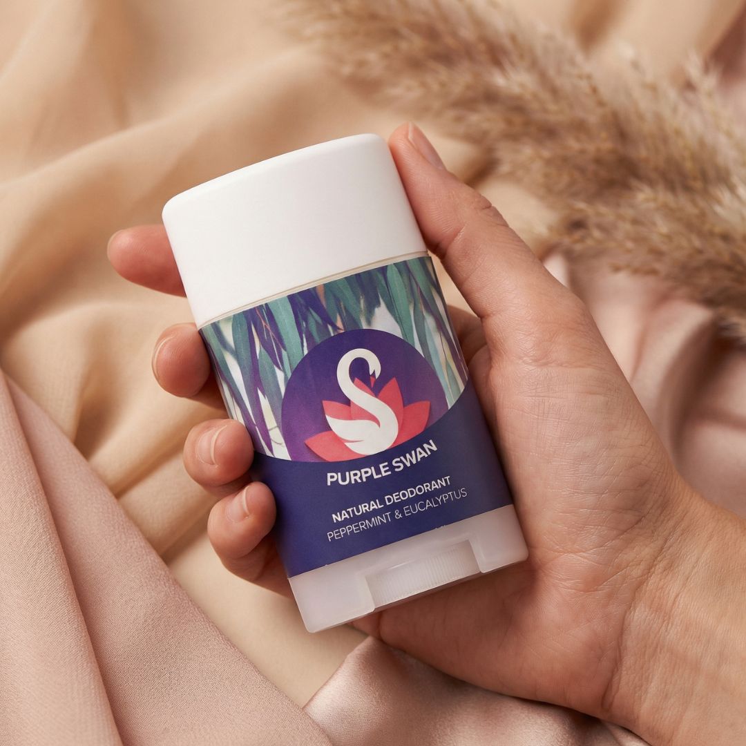 Hand Holding Purple Swan Peppermint & Eucayptus Deodarant 
